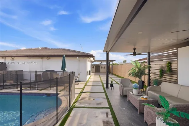 a view of a house with backyard and porch