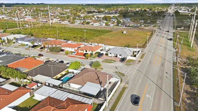 an aerial view of a house with a ocean view