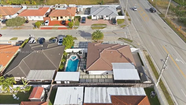 an aerial view of houses with outdoor space