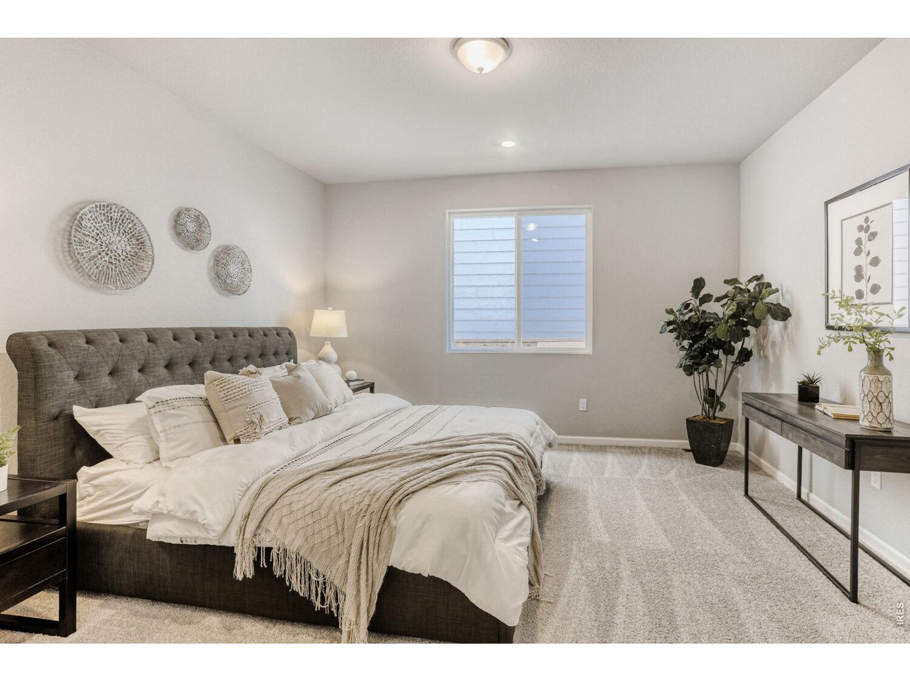 191 Buckwheat Lane Berthoud, CO 80513 - Photo 13 of 31 a bedroom with a bed and a table