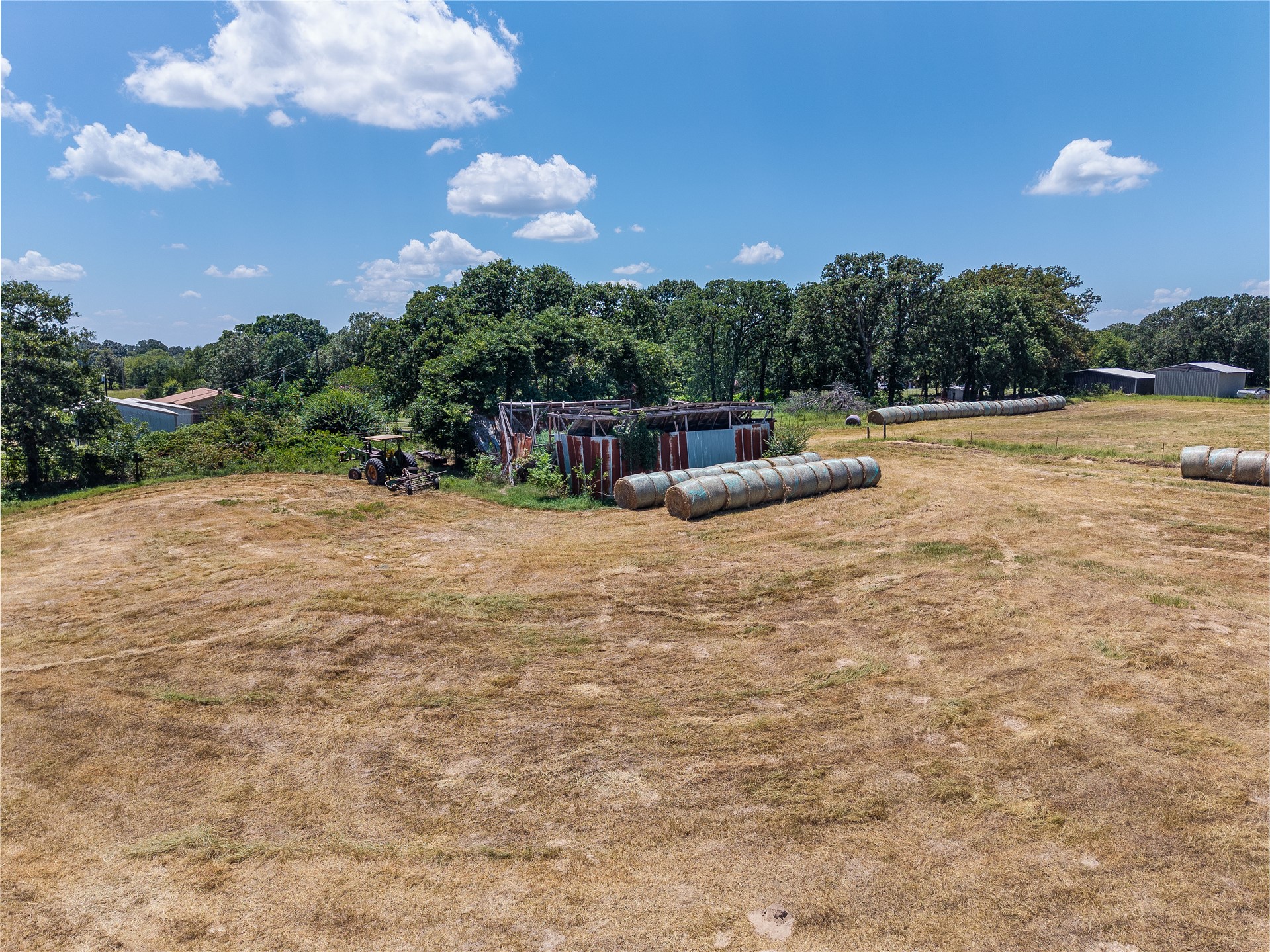 20 Red Hill Road Antlers, OK 74523 - Photo 13 of 17 Expansive open field with scattered hay bales