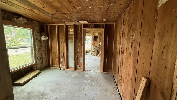 a view of entryway with wooden walls