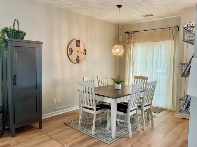 a kitchen with a refrigerator stove top oven and sink