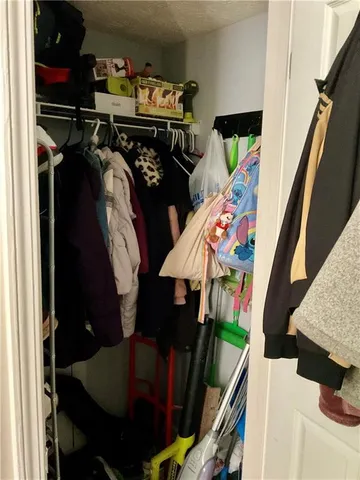 a spacious bedroom with a bed and window