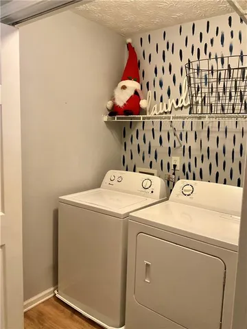 a bathroom with a tub sink and cabinets