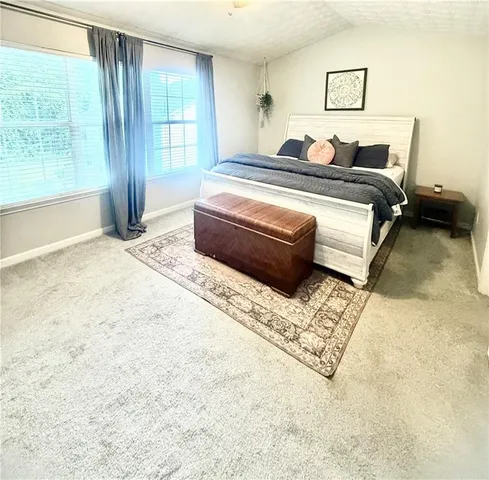 a view of a room with a sink and cabinets