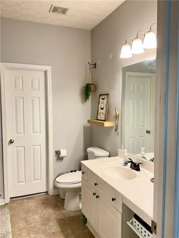 a view of a roof deck with wooden floor and fence