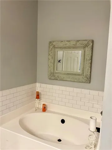 a view of a house with a wooden deck