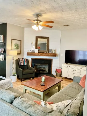 a living room with furniture and a rug