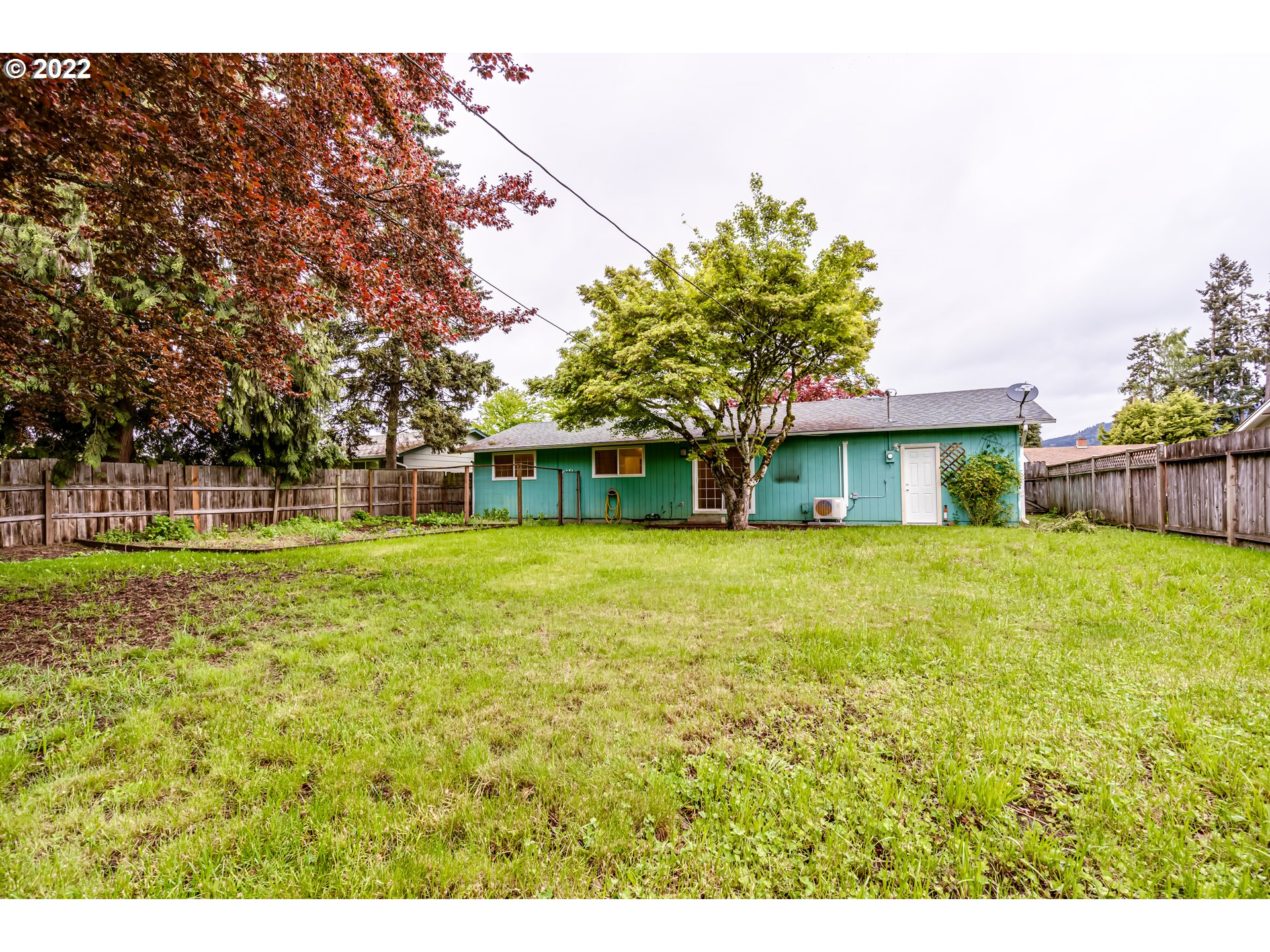 401 U Street Springfield, OR 97477 - Photo 27 of 29 a front view of a house with a yard