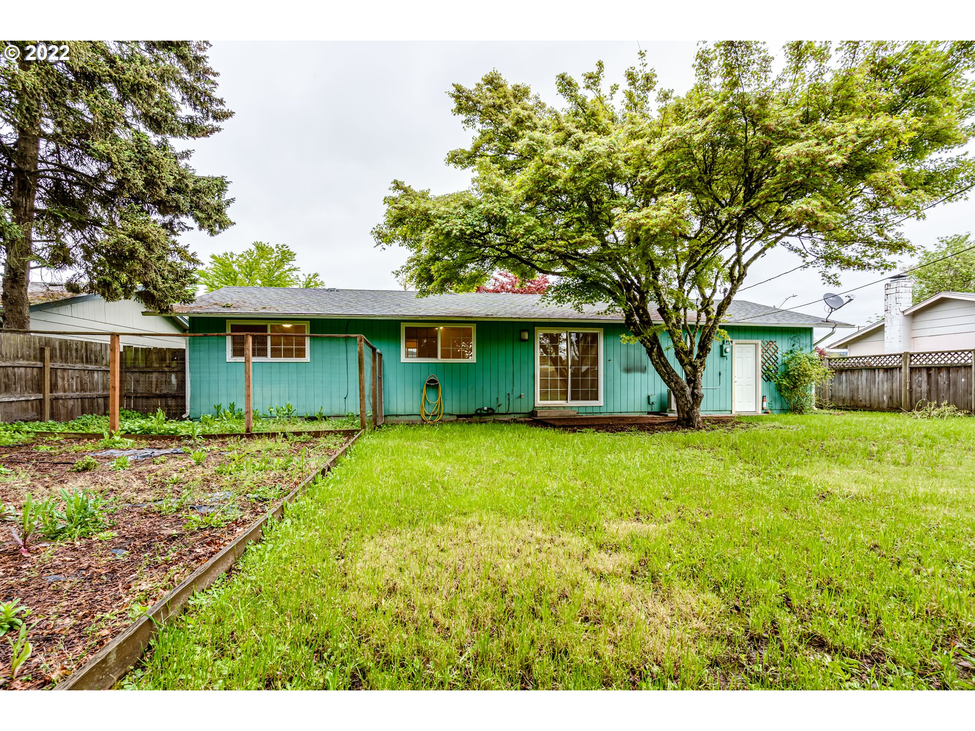 401 U Street Springfield, OR 97477 - Photo 29 of 29 a front view of a house with a garden