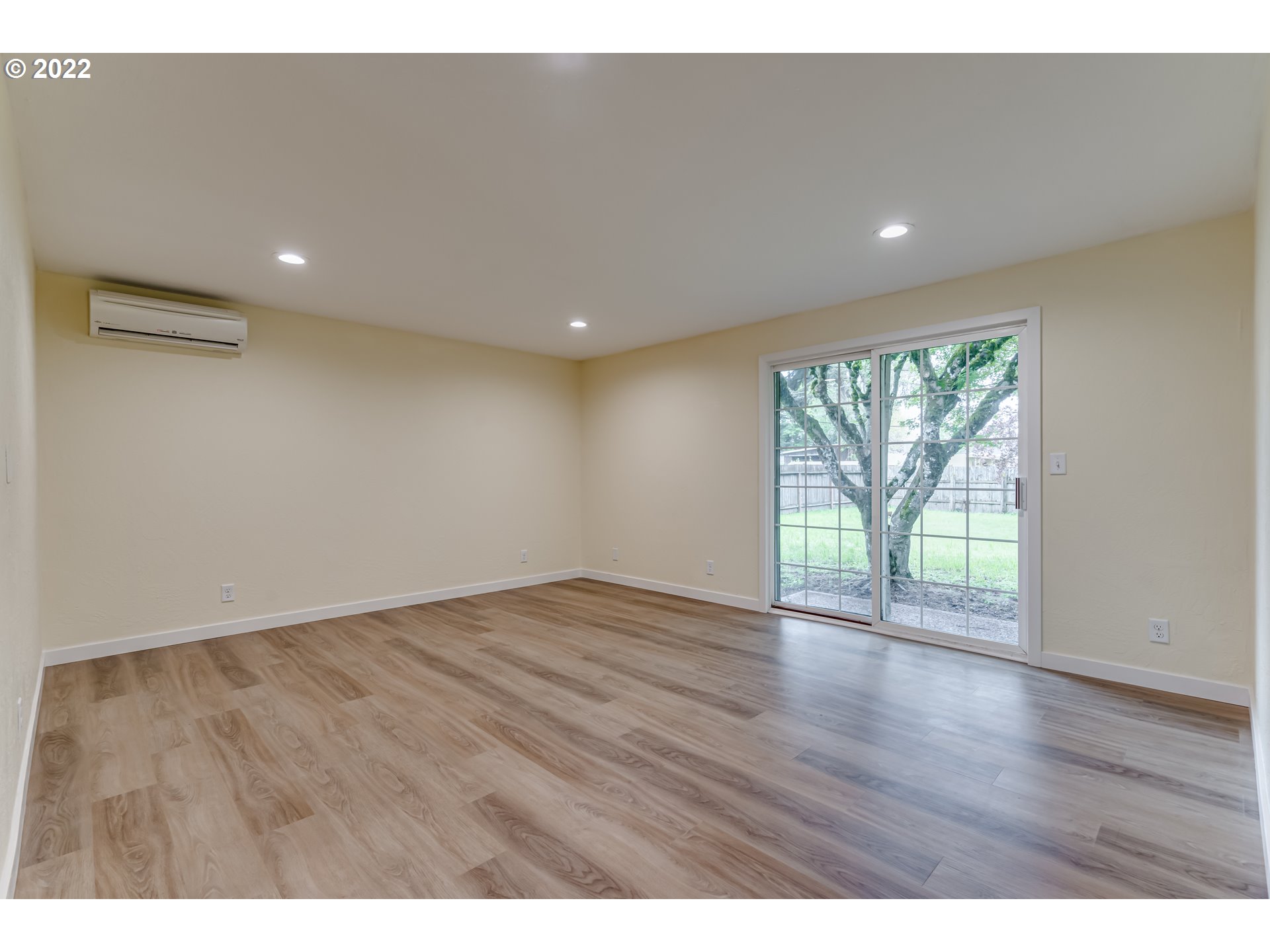 401 U Street Springfield, OR 97477 - Photo 5 of 29 a view of an empty room with wooden floor and a window