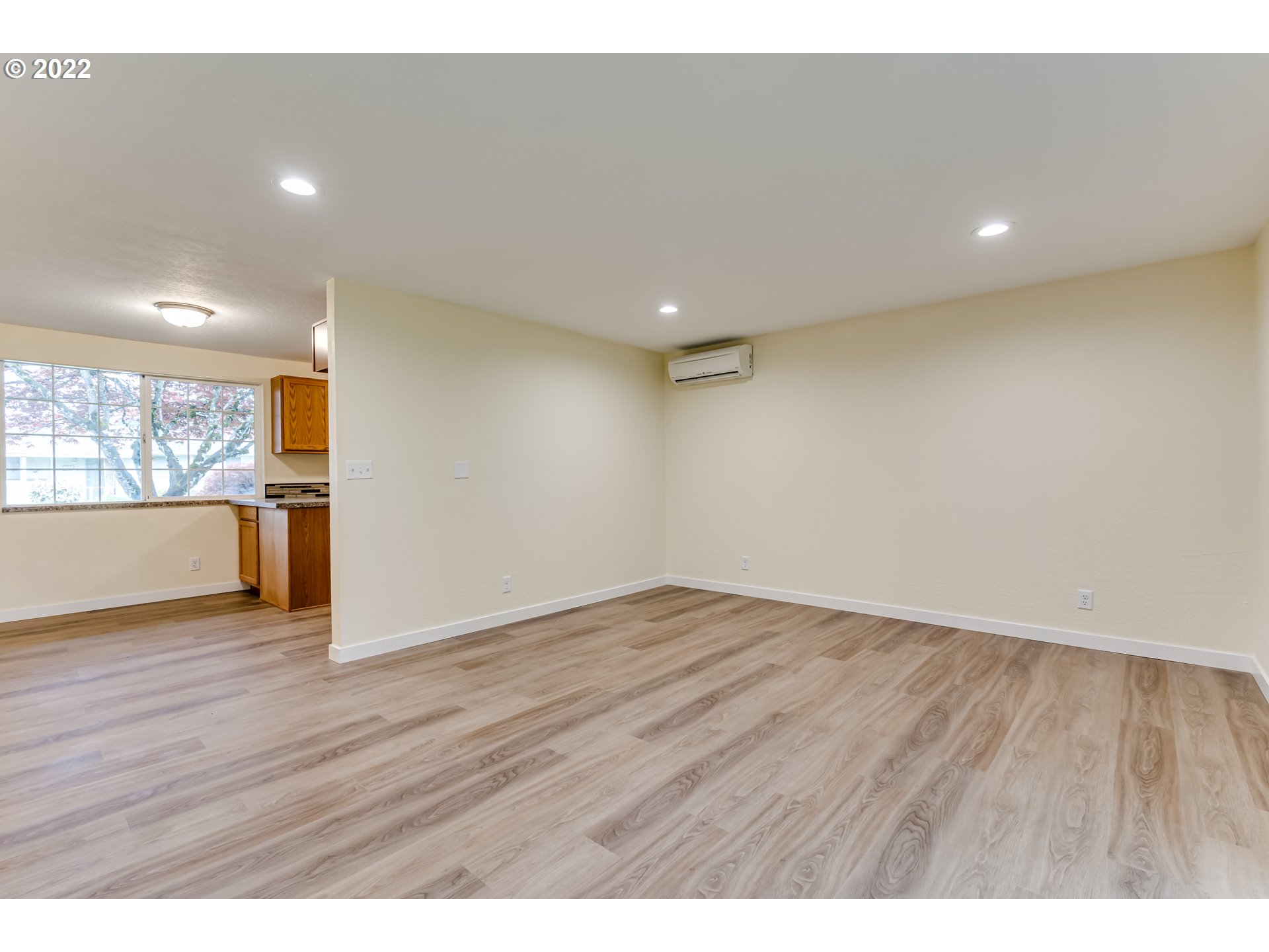 401 U Street Springfield, OR 97477 - Photo 6 of 29 a view of an empty room with wooden floor and a window