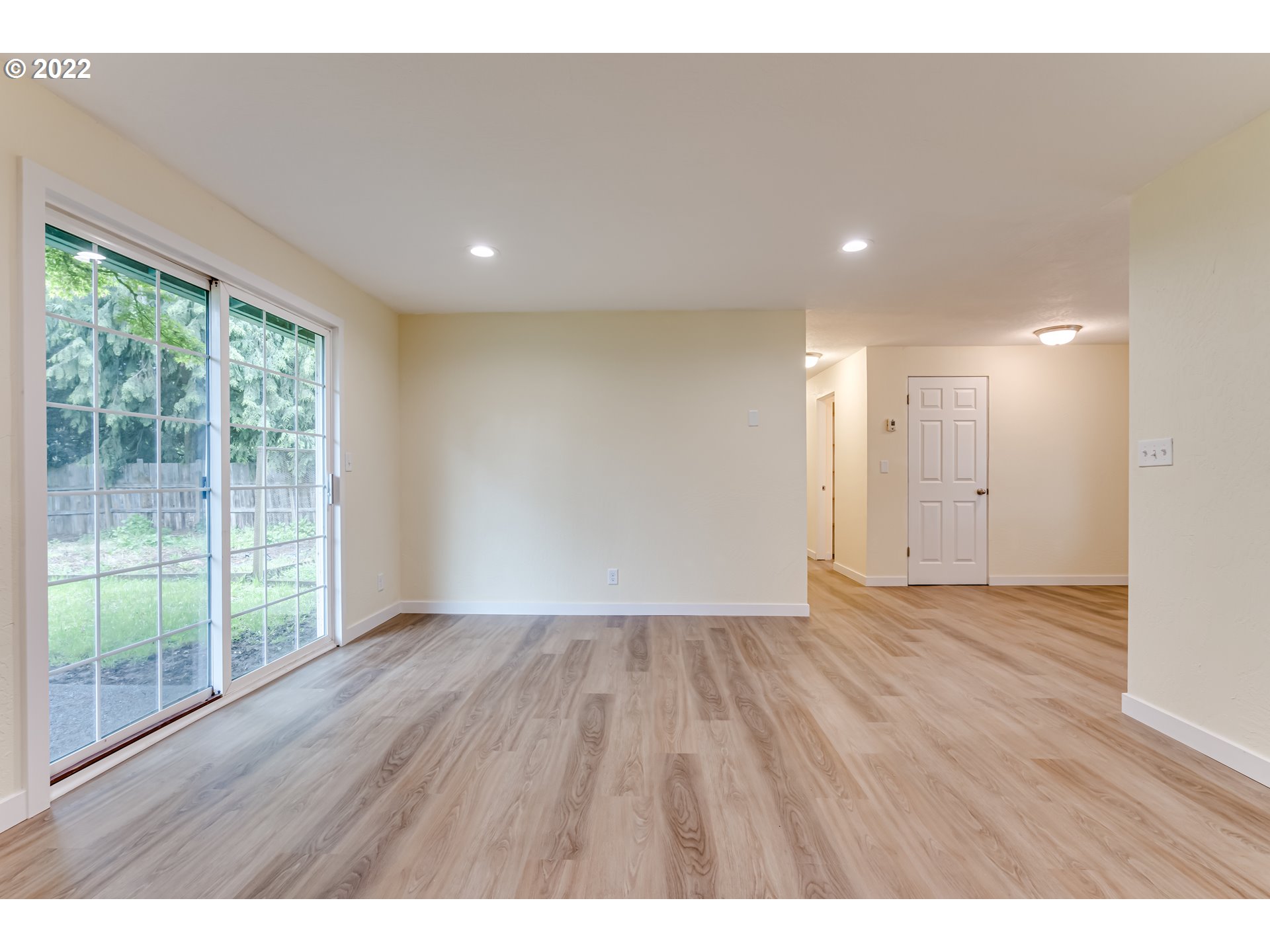 401 U Street Springfield, OR 97477 - Photo 7 of 29 a view of an empty room with wooden floor and a window