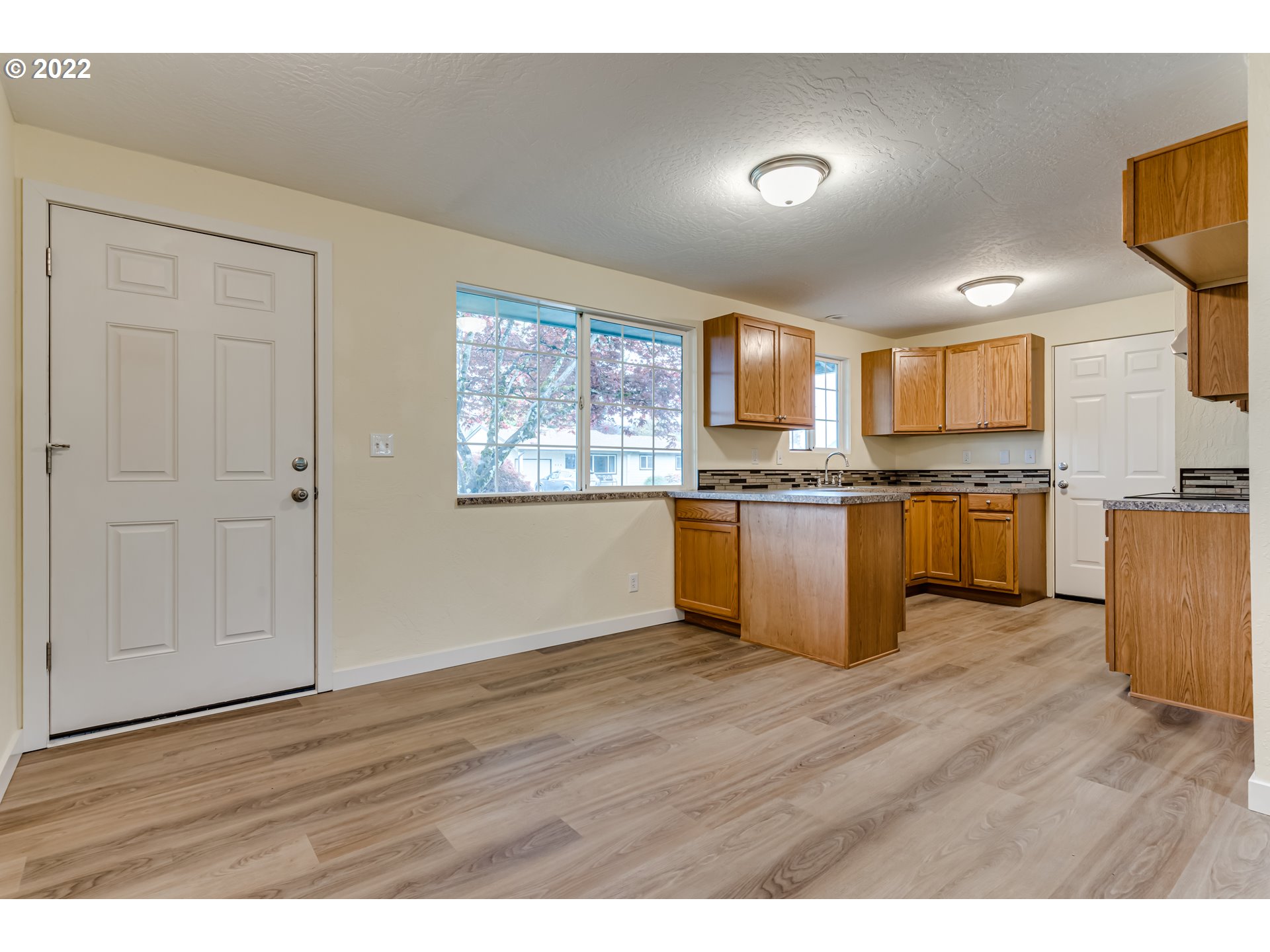 401 U Street Springfield, OR 97477 - Photo 10 of 29 a view of kitchen with wooden floor