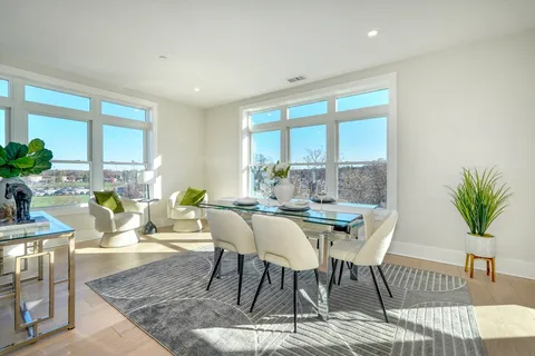 a view of a dining room with furniture window and outside view