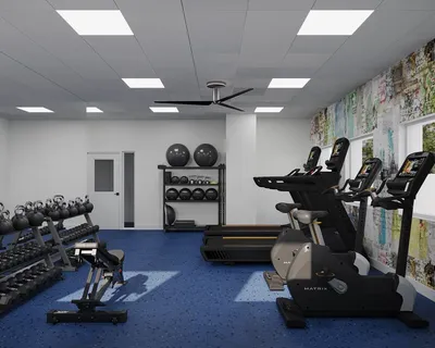 a room with gym equipment and a mirror