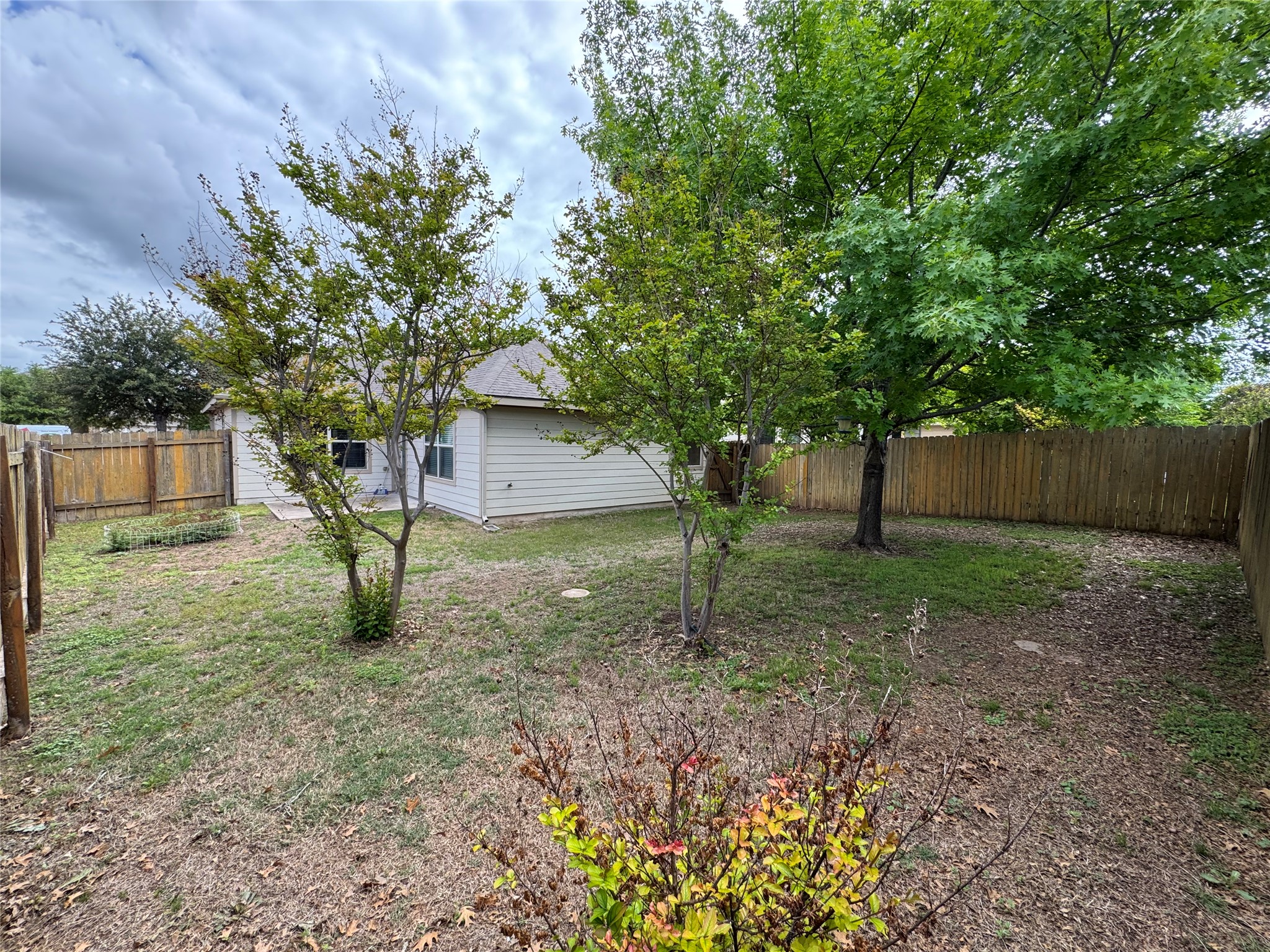 112 Eagle Owl Loop Leander, TX 78641 - Photo 12 of 17 View of fenced backyard