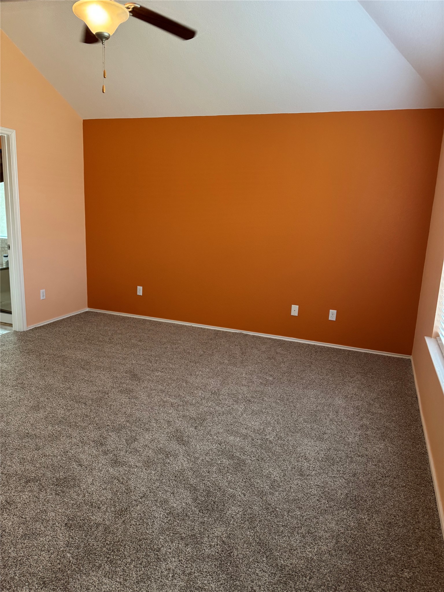 112 Eagle Owl Loop Leander, TX 78641 - Photo 8 of 17 Carpeted empty room featuring lofted ceiling and a ceiling fan