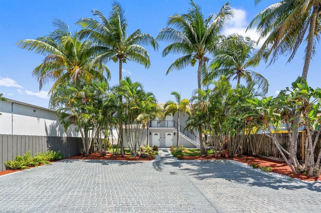 45 Northeast 24th Street, Unit B Wilton Manors, FL 33305 - Photo 2 of 19 a view of a backyard with a patio