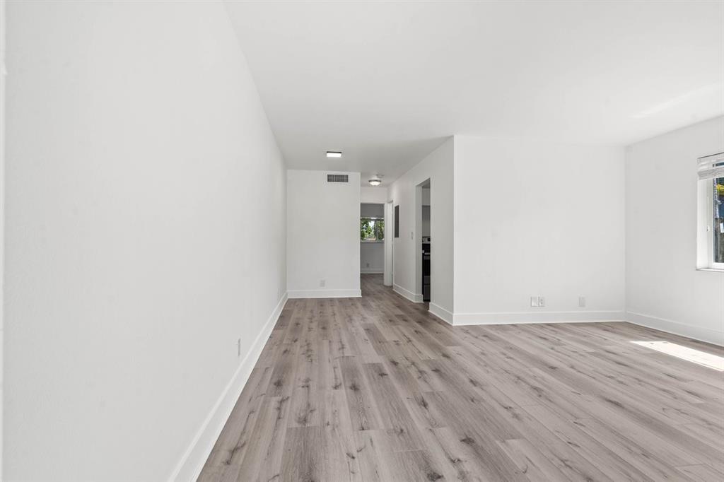45 Northeast 24th Street, Unit B Wilton Manors, FL 33305 - Photo 4 of 19 a view of an empty room with wooden floor