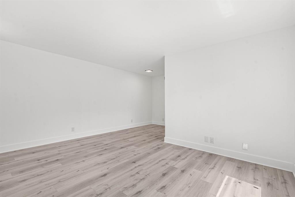 45 Northeast 24th Street, Unit B Wilton Manors, FL 33305 - Photo 7 of 19 wooden floor in a empty room
