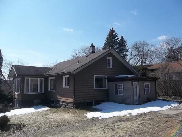 1403 Ogilby Road Rockford, IL 61102 - Photo 2 of 7 a front view of a house with a yard