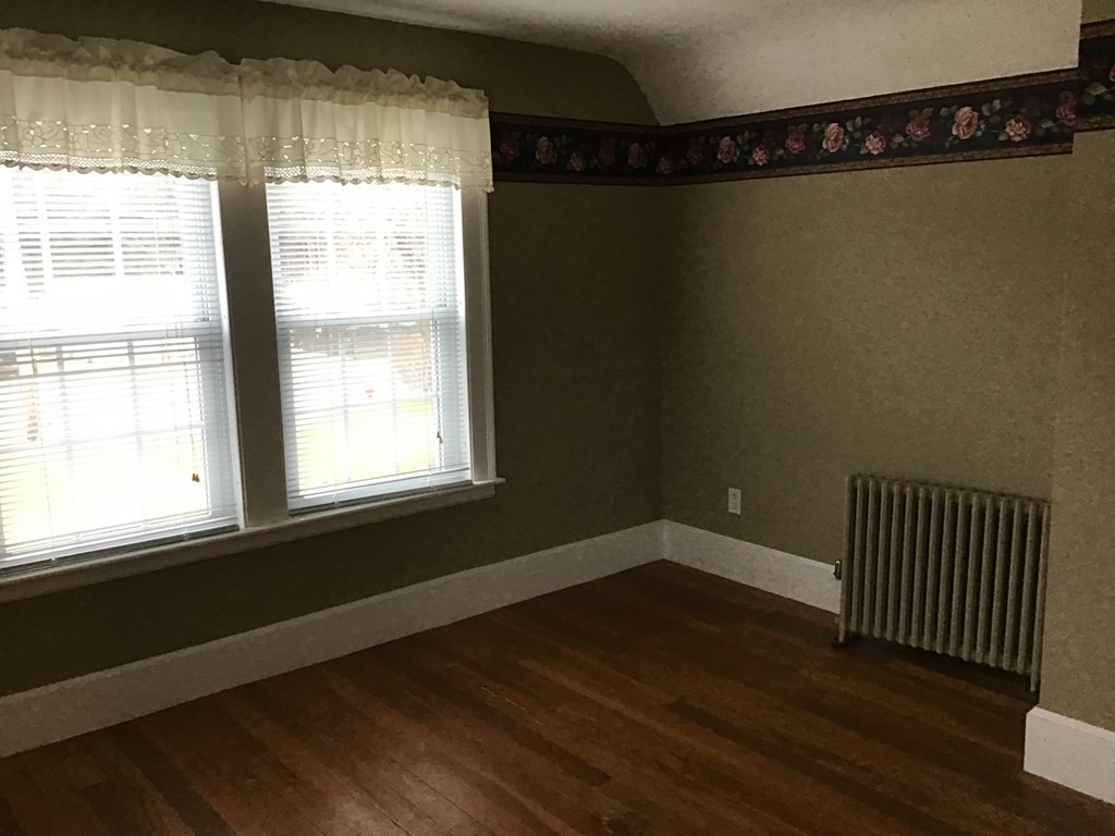 1800 Barre Road Hardwick, MA 01031 - Photo 13 of 20 a view of an empty room with wooden floor and a window