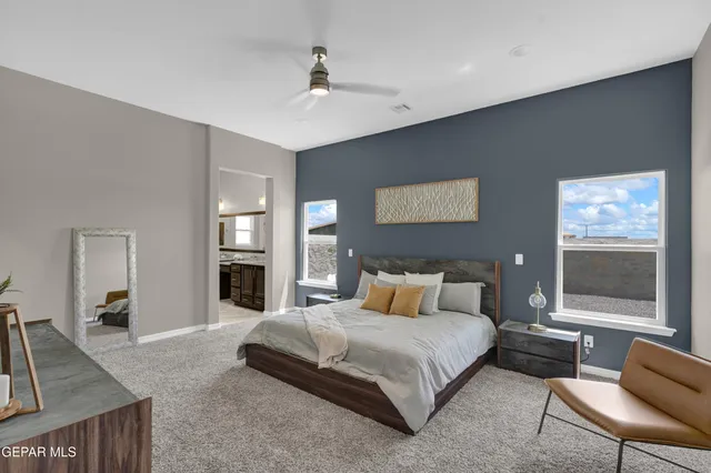 a bedroom with a bed and window