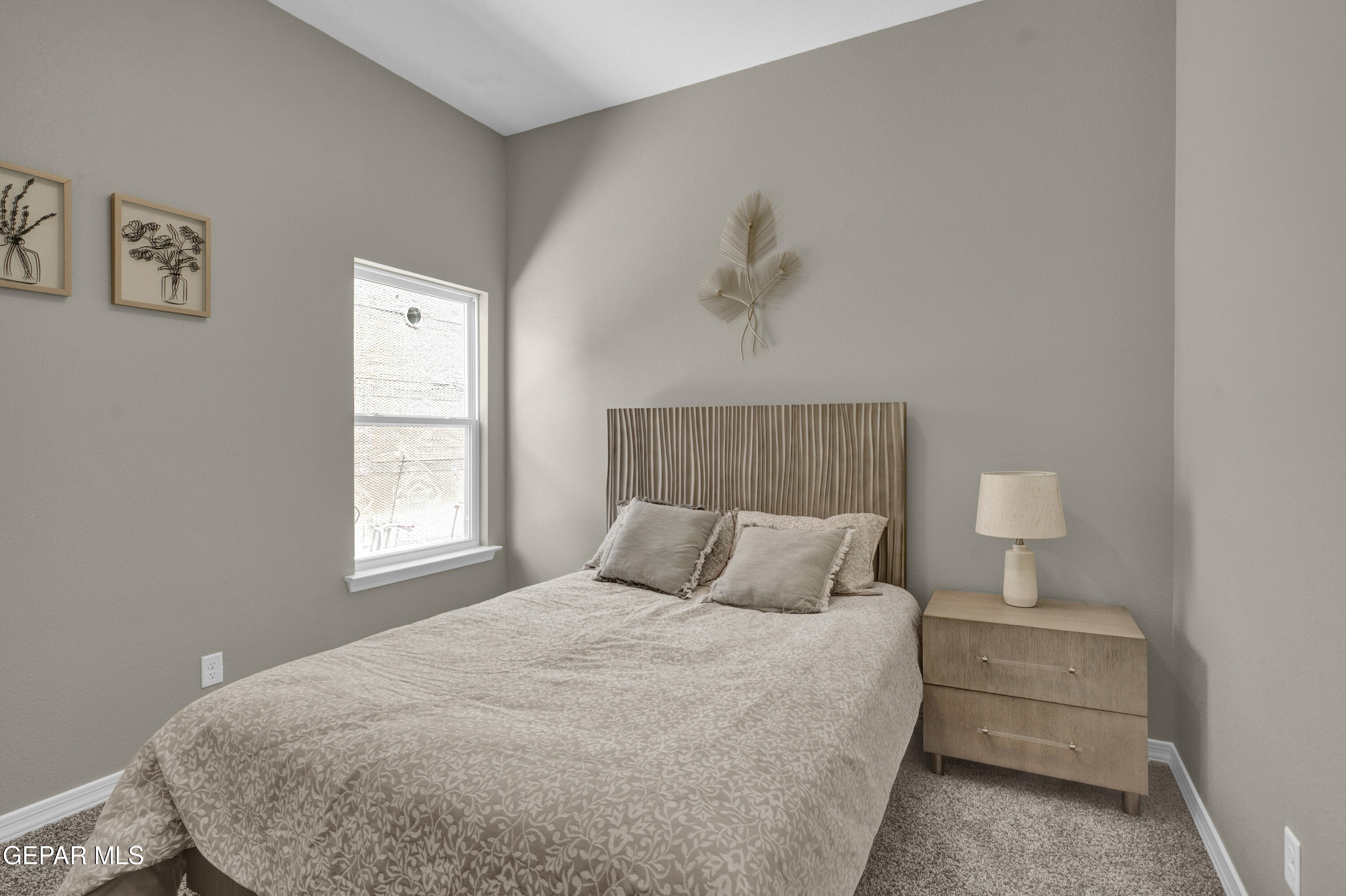 6958 Levee Circle El Paso, TX 79932 - Photo 45 of 55 a bedroom with a bed and a window