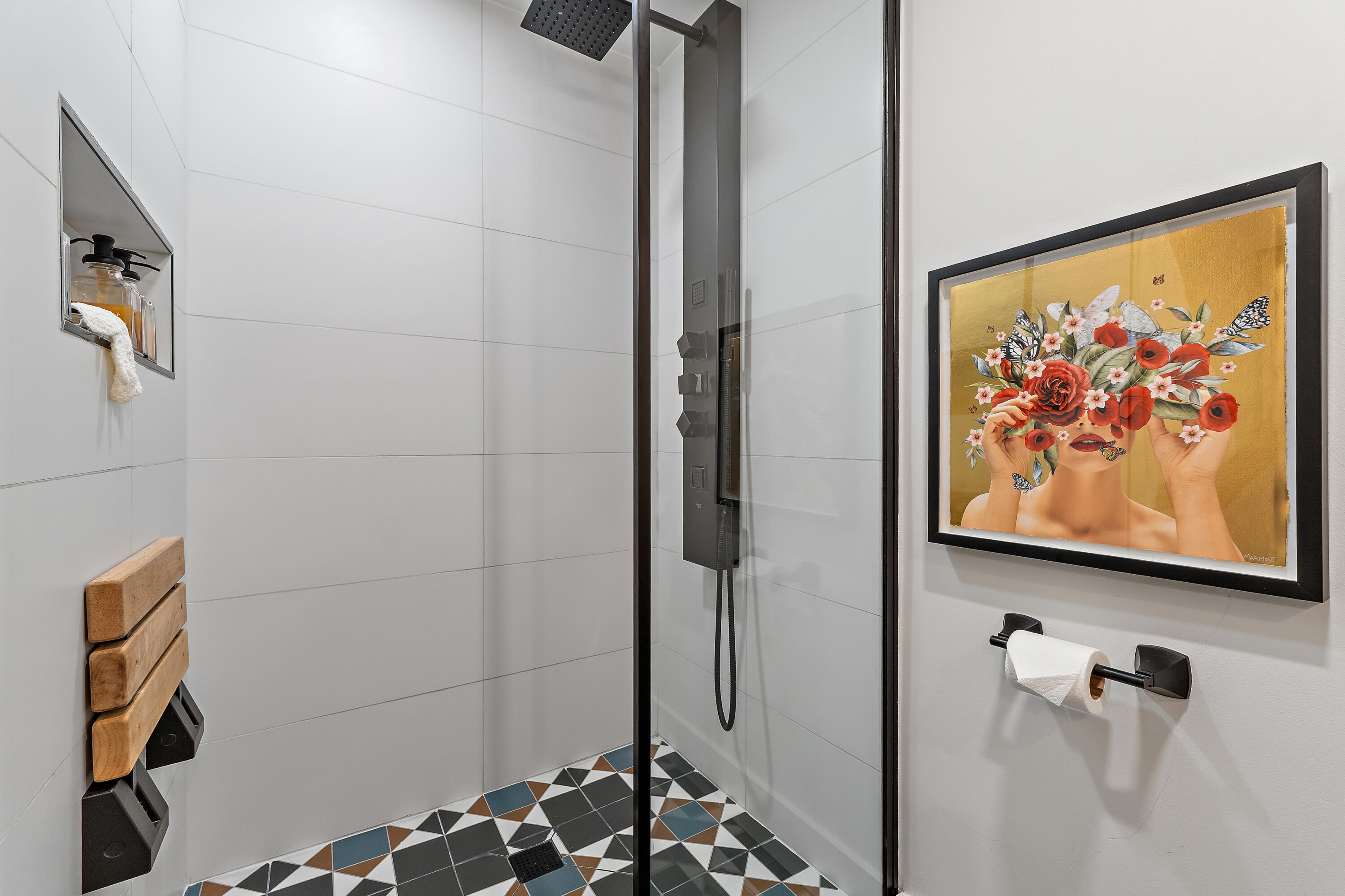 50 Celestial Way, Unit 310 Juno Beach, FL 33408 - Photo 23 of 33 a bathroom with a painting on the wall and shower