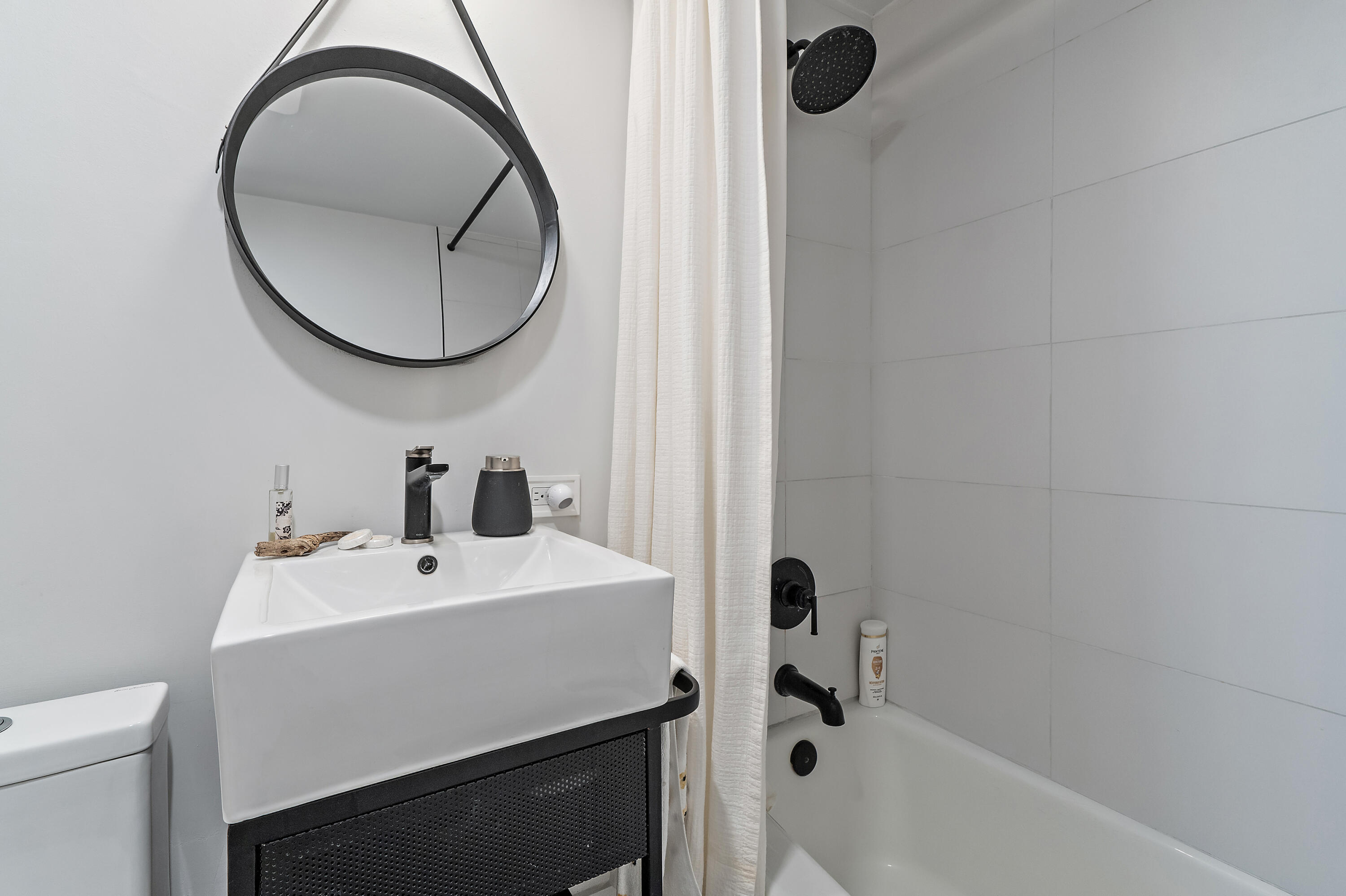 50 Celestial Way, Unit 310 Juno Beach, FL 33408 - Photo 26 of 33 a bathroom with a sink and a mirror