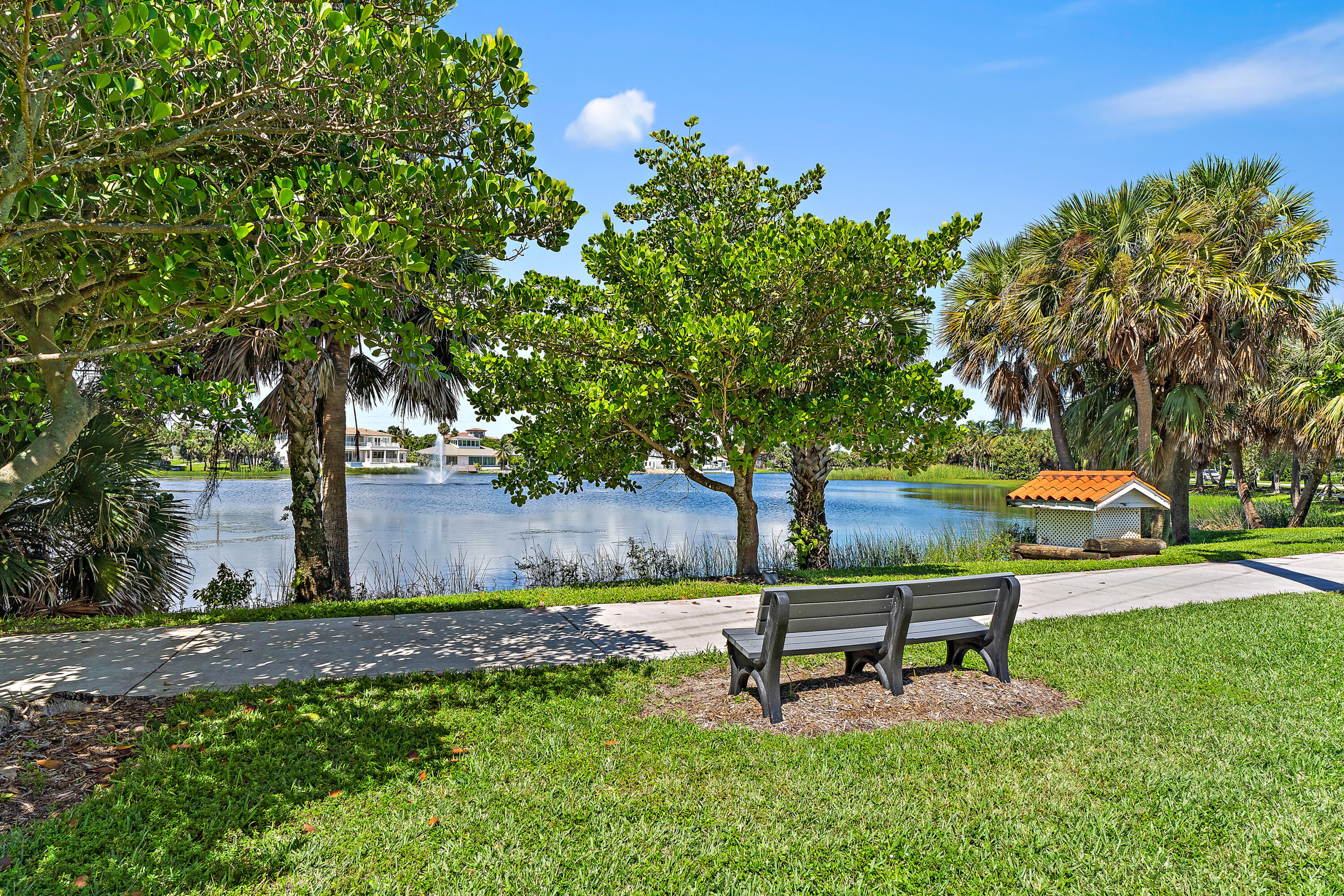 50 Celestial Way, Unit 310 Juno Beach, FL 33408 - Photo 30 of 33 a park bench sitting in the middle of a park