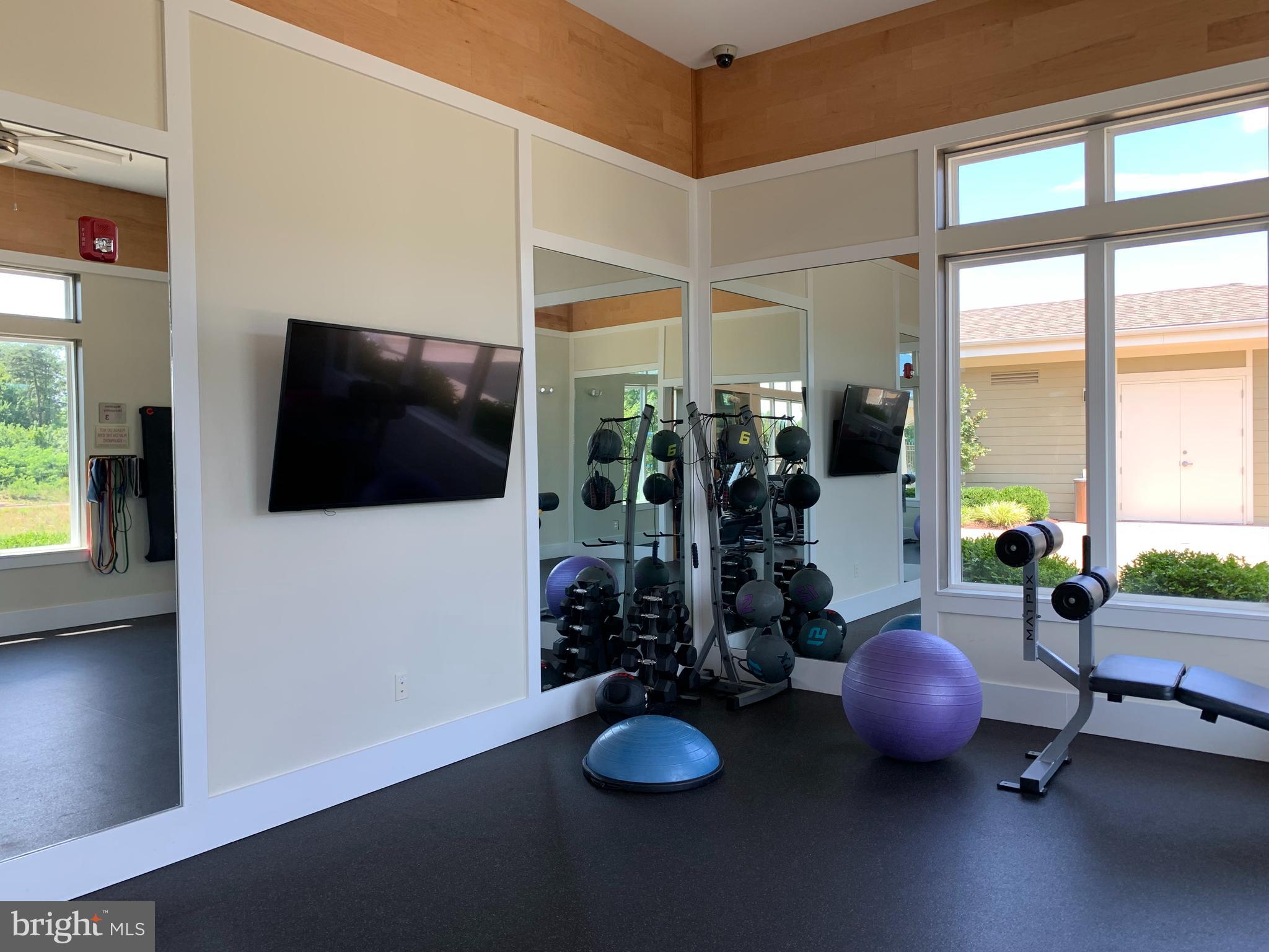 22283 Philanthropic Drive Ashburn, VA 20148 - Photo 17 of 17 a room with wooden floor and large windows