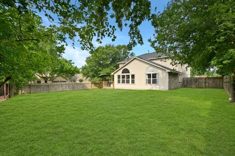 a view of a backyard of the house
