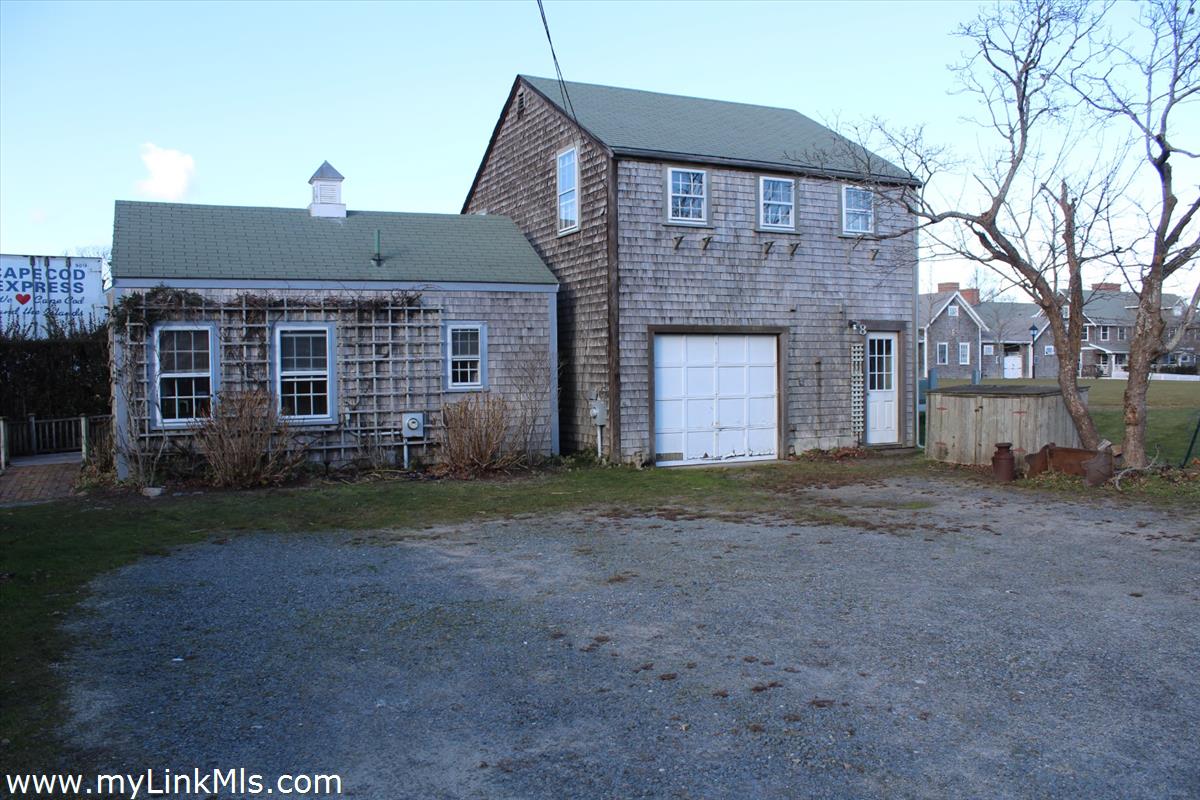 8 Sea Street Nantucket, MA 02554 - Photo 1 of 7 a front view of a house with a yard