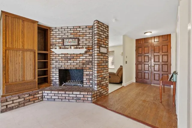 a view of livingroom with furniture and a fireplace