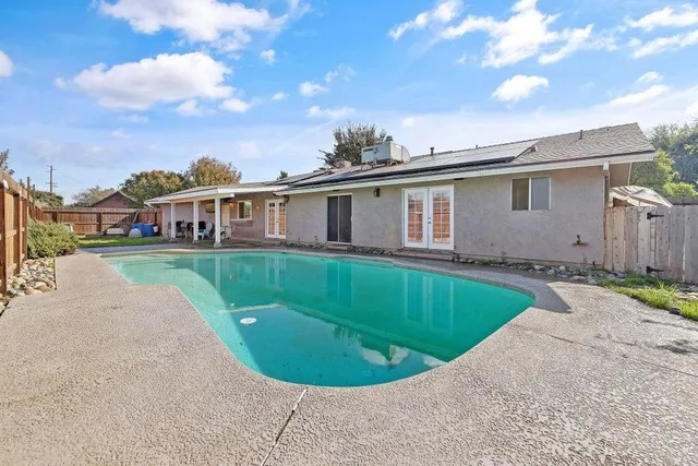 a view of a house with a swimming pool