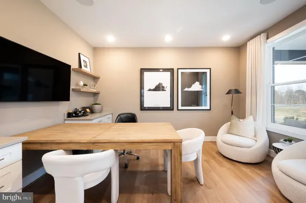 a room with furniture and a flat screen tv