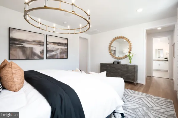 a bedroom with a bed and a mirror