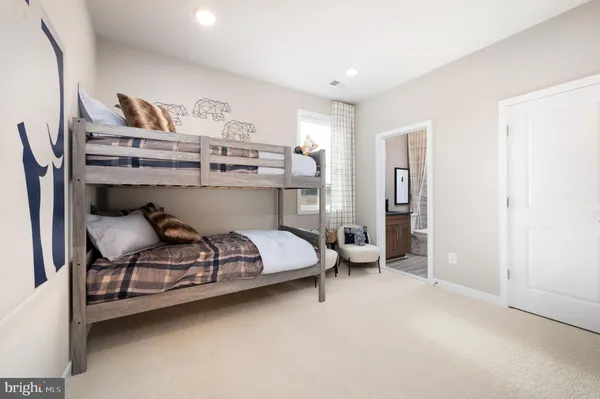 a bedroom with a bed and a table