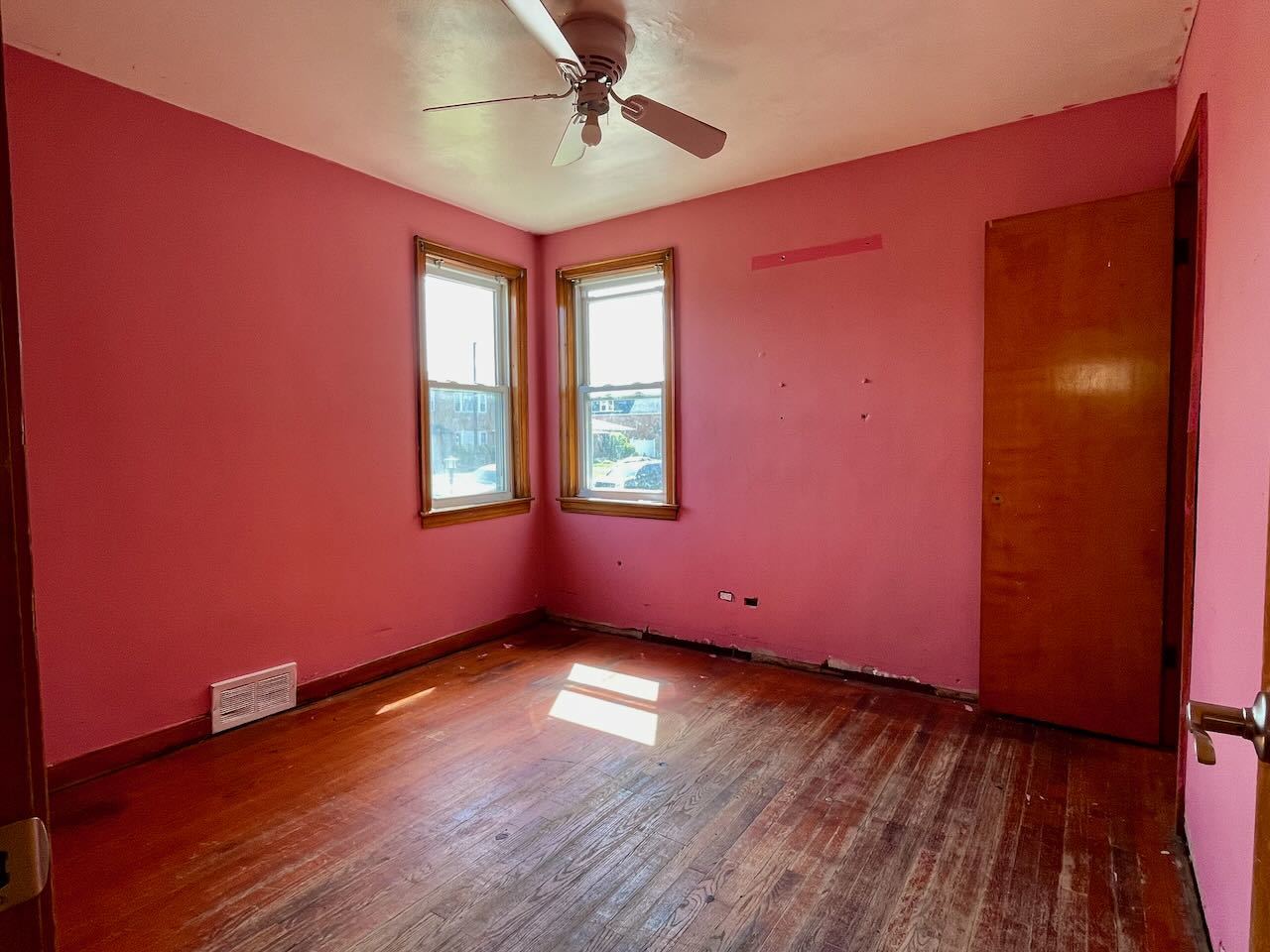 7304 West 57th Street Summit, IL 60501 - Photo 12 of 32 a view of an empty room with wooden floor and a window