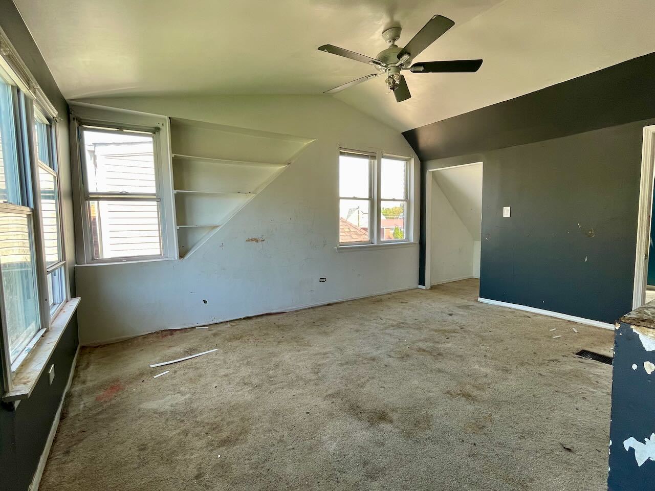 7304 West 57th Street Summit, IL 60501 - Photo 16 of 32 an empty room with windows and fan