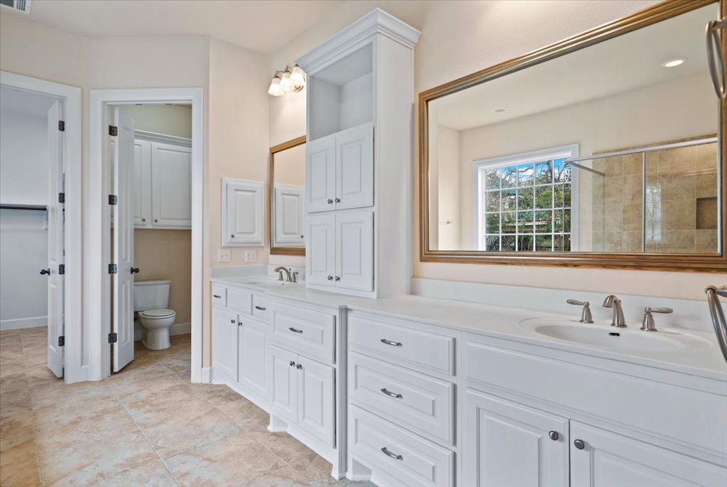 3006 Washington Square Austin, TX 78705 - Photo 17 of 40 a spacious bathroom with double sink and a mirror