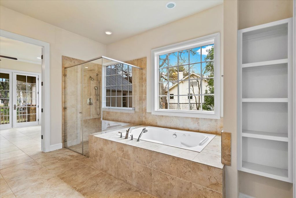 3006 Washington Square Austin, TX 78705 - Photo 18 of 40 a bathroom with a tub and a window