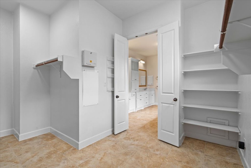 3006 Washington Square Austin, TX 78705 - Photo 19 of 40 a view of room with walk in closet and window