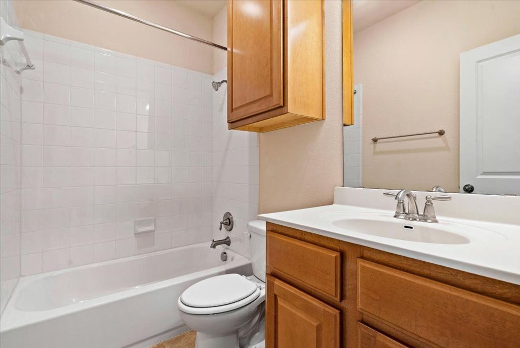 3006 Washington Square Austin, TX 78705 - Photo 23 of 40 a bathroom with a sink a toilet and bathtub