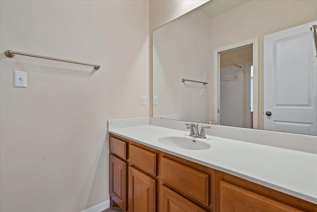3006 Washington Square Austin, TX 78705 - Photo 25 of 40 a bathroom with a sink and a mirror