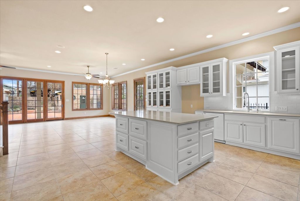 3006 Washington Square Austin, TX 78705 - Photo 10 of 40 a large kitchen with granite countertop a large counter top and wooden floors