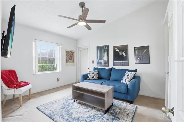 a living room with furniture and a window